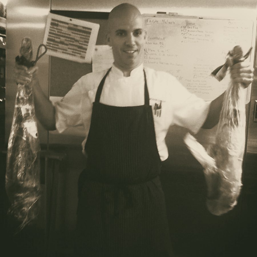 Chef Jackson Locklear with two legs of jamón ibérico de bellota, Miami, 2012