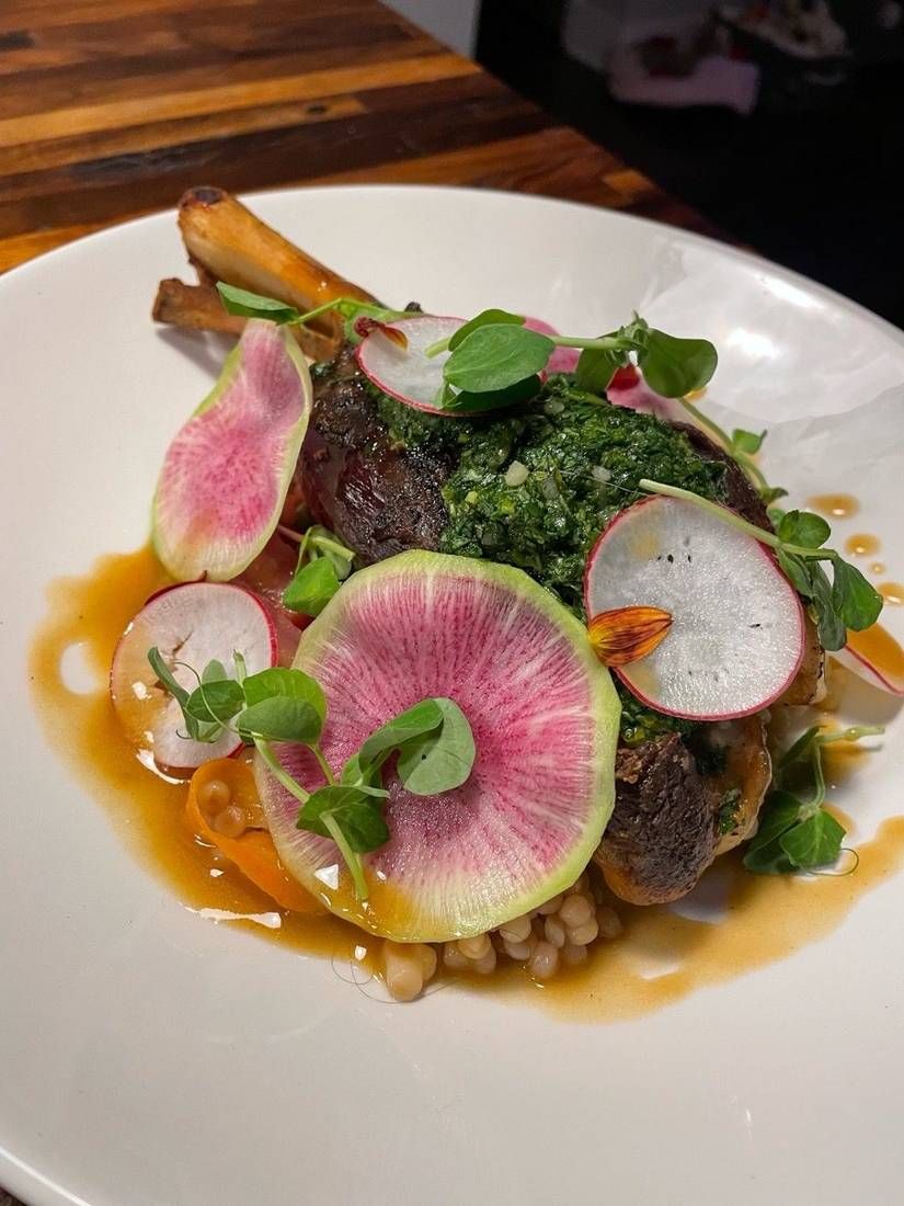 Lamb osso buco with Israeli couscous and gremolata, plated by private chef Jackson Locklear