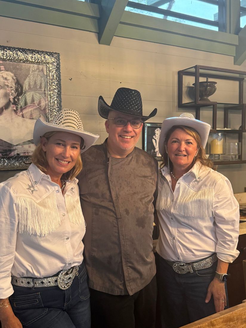 Private chef Jackson Locklear with guests at a western-themed celebration